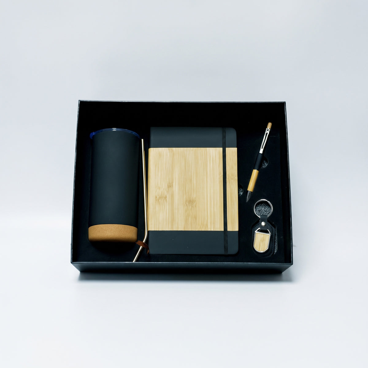Custom laser-engraved 4-piece eco executive gift set in matte black, bamboo, and cork by Print365 Kenya