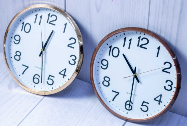 Custom laser-printed metallic gold and polished brown wall clock by Print365 Kenya