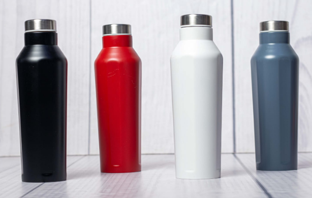 Display of custom powder-coated geometric steel thermal flasks in black red white grey by Print365 Kenya