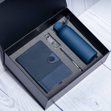 Custom laser-engraved executive 4-in-1 corporate gift set in blue with circular badge notebook by Print365 Kenya