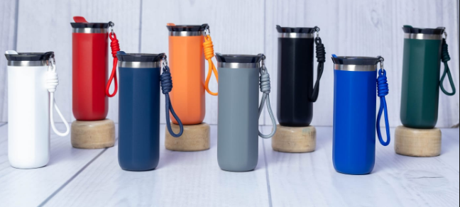 Display of custom powder-coated stainless steel thermal travel tumblers with matching rope lanyards by Print365 Kenya