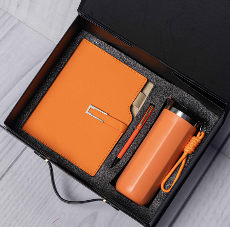 Custom laser-engraved executive 3-in-1 corporate gift set in orange with suitcase box by Print365 Kenya