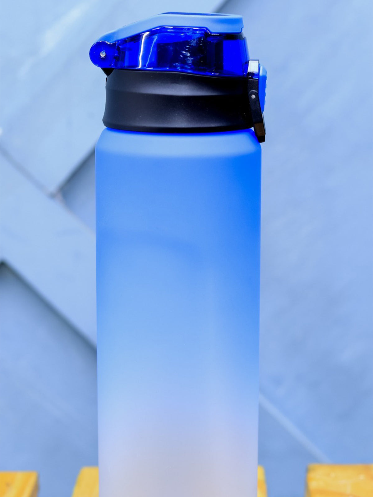 Gradient blue custom water bottle with a black cap done by Print365 Nairobi
