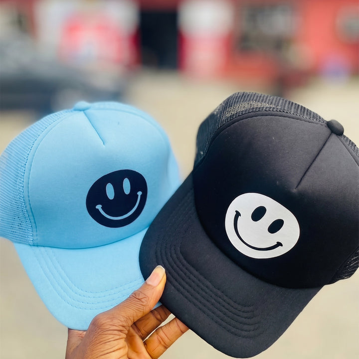 2 different coloured trucker hats personalized by Print365 Kenya