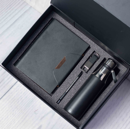 Custom laser-engraved executive 4-in-1 corporate gift set in black with metallic neck thermal bottle by Print365 Kenya