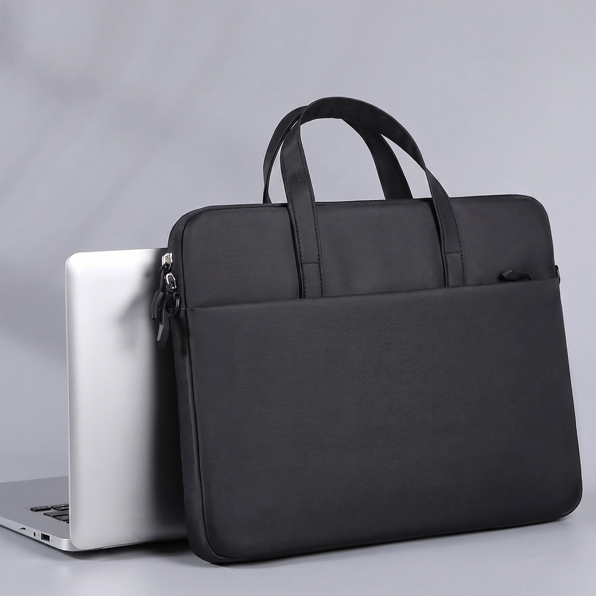 Custom laptop sleeve next to laptop done by Print365 Nairobi