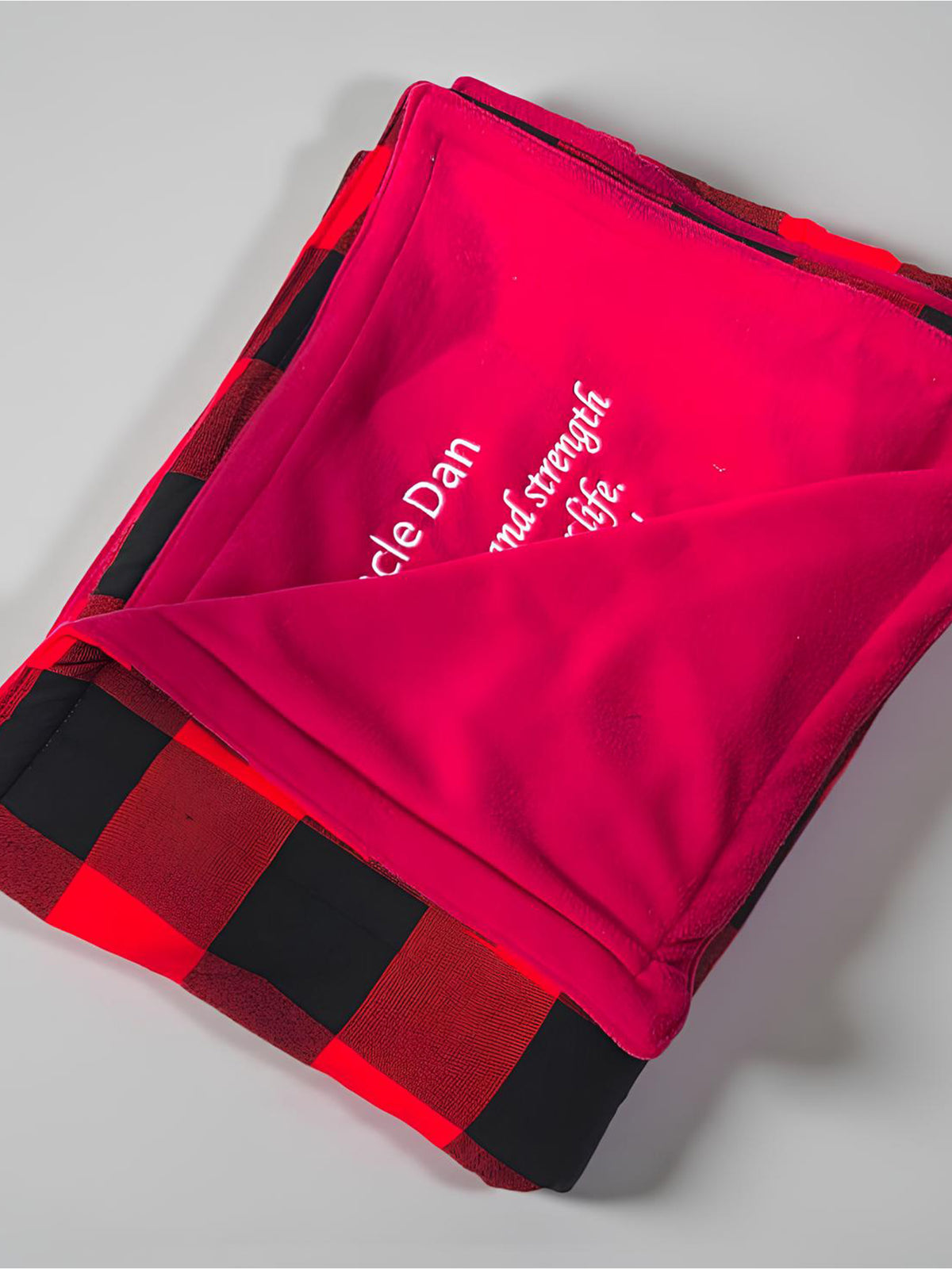 Executive dual-layer Maasai Shuka in classic red and black plaid with soft polar fleece backing priced at Ksh 2700 in Nairobi