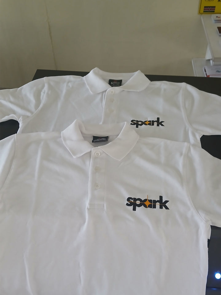 White polo  with custom embroidered logo on chest