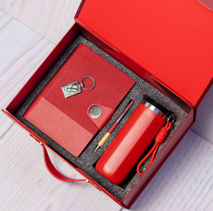 Custom laser-engraved executive 4-in-1 corporate gift set in red with suitcase box by Print365 Kenya