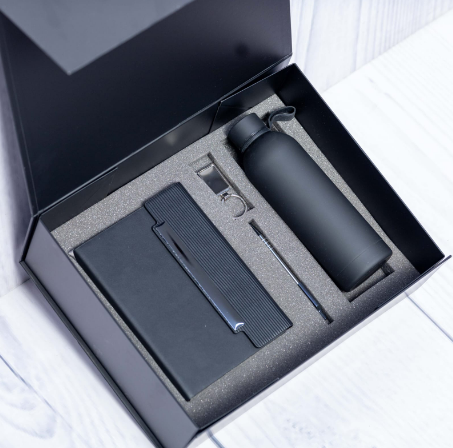 Custom laser-engraved executive 4-in-1 corporate gift set in black with diagonal-ribbed notebook by Print365 Kenya