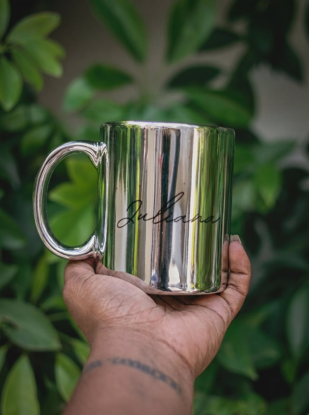 Custom reflective silver ceramic mug with the name 'Juliana' printed in black script in Nairobi, Kenya