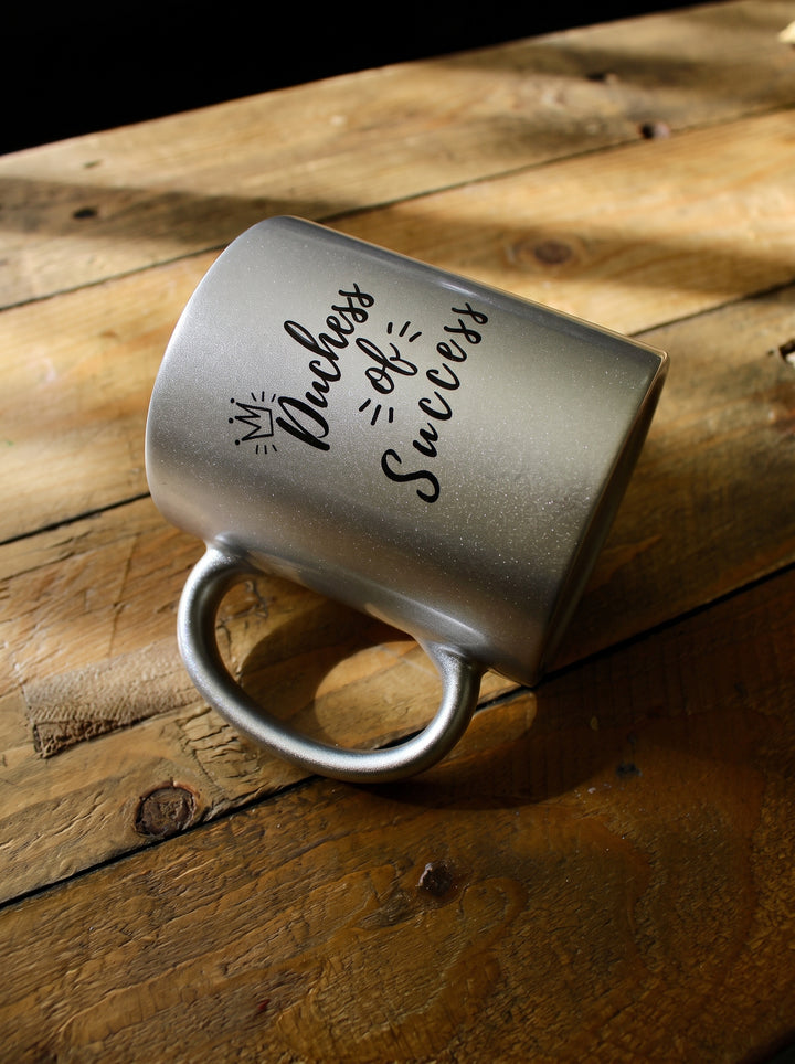 A personalized metallic silver ceramic mug with the phrase &